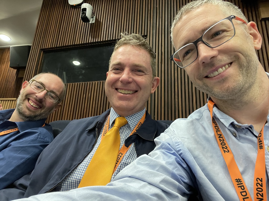 Team members Chris Hall (left), Esmond Urwin (middle) and Gordon Milligan (right) enjoying themselves at the IPDLN conference.